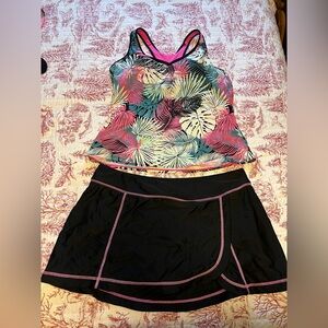 women's tropical print tankini top and black swim skirt set.